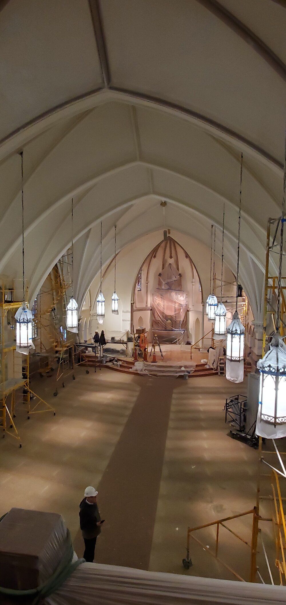 A large church with a vaulted ceiling is being remodeled.