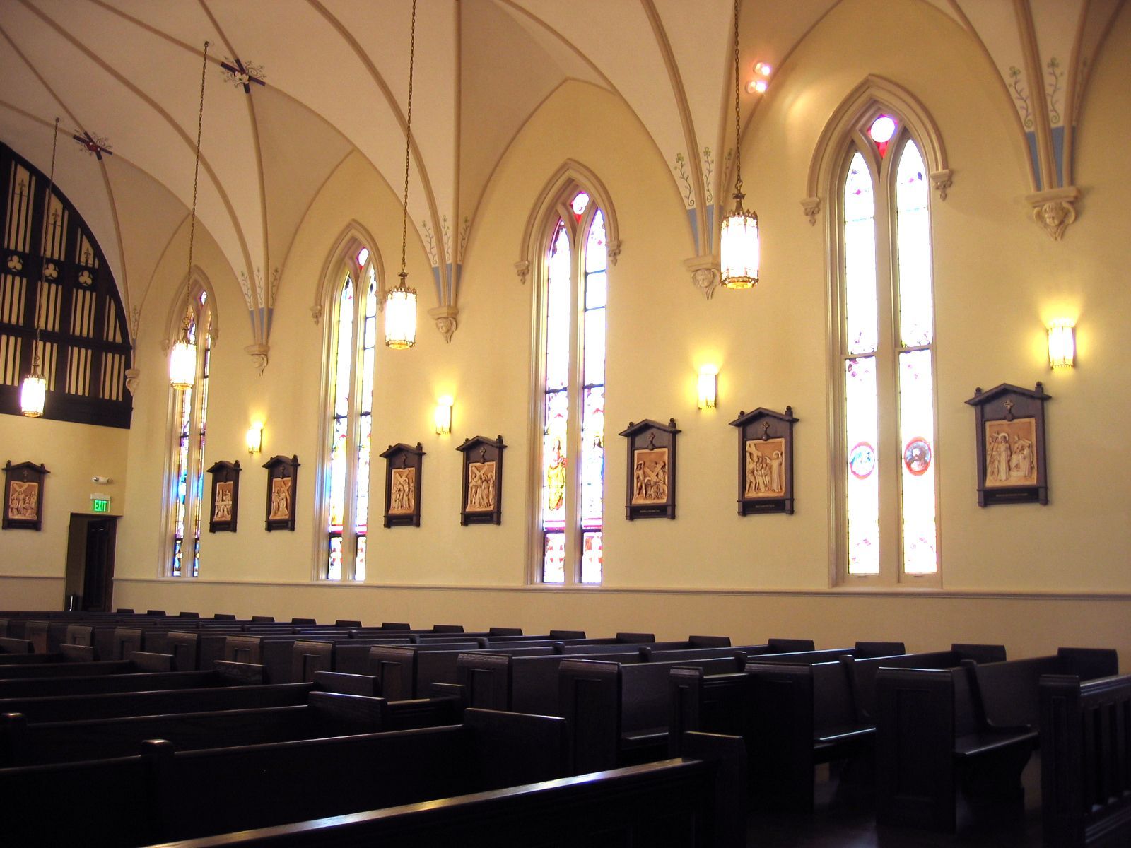 The inside of a church with stained glass windows