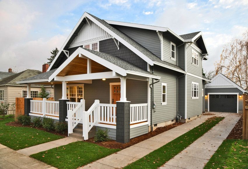 Gray two-story house with white trim