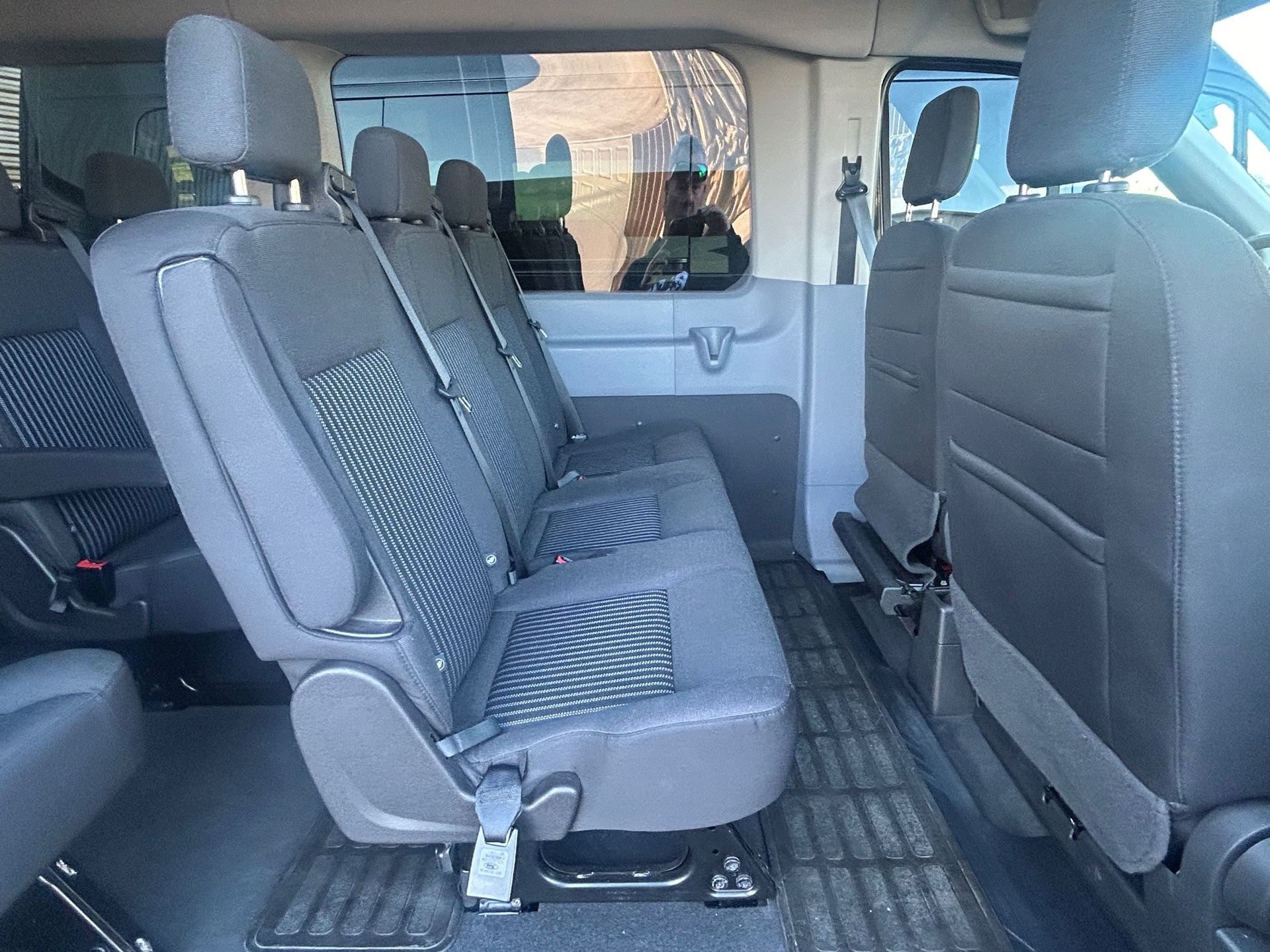 The back seat of a van with a lot of seats