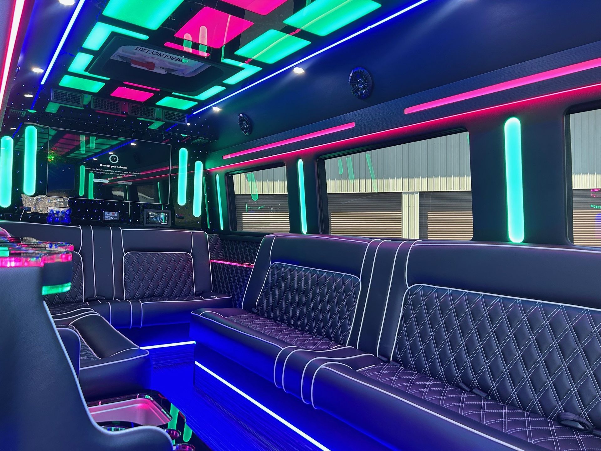 The inside of a limousine with a lot of lights on it.
