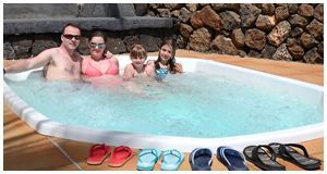 Happy family in tropical jacuzzi
