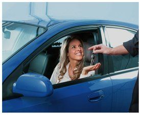 Man giving car keys to a client