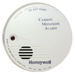 Round white Honeywell carbon monoxide alarm with test button and speaker grille.