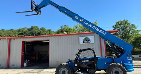 A blue forklift is parked