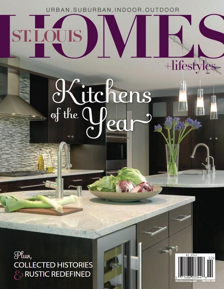 Cover of St. Louis Homes + Lifestyles magazine featuring a modern kitchen with dark cabinets and a white island.