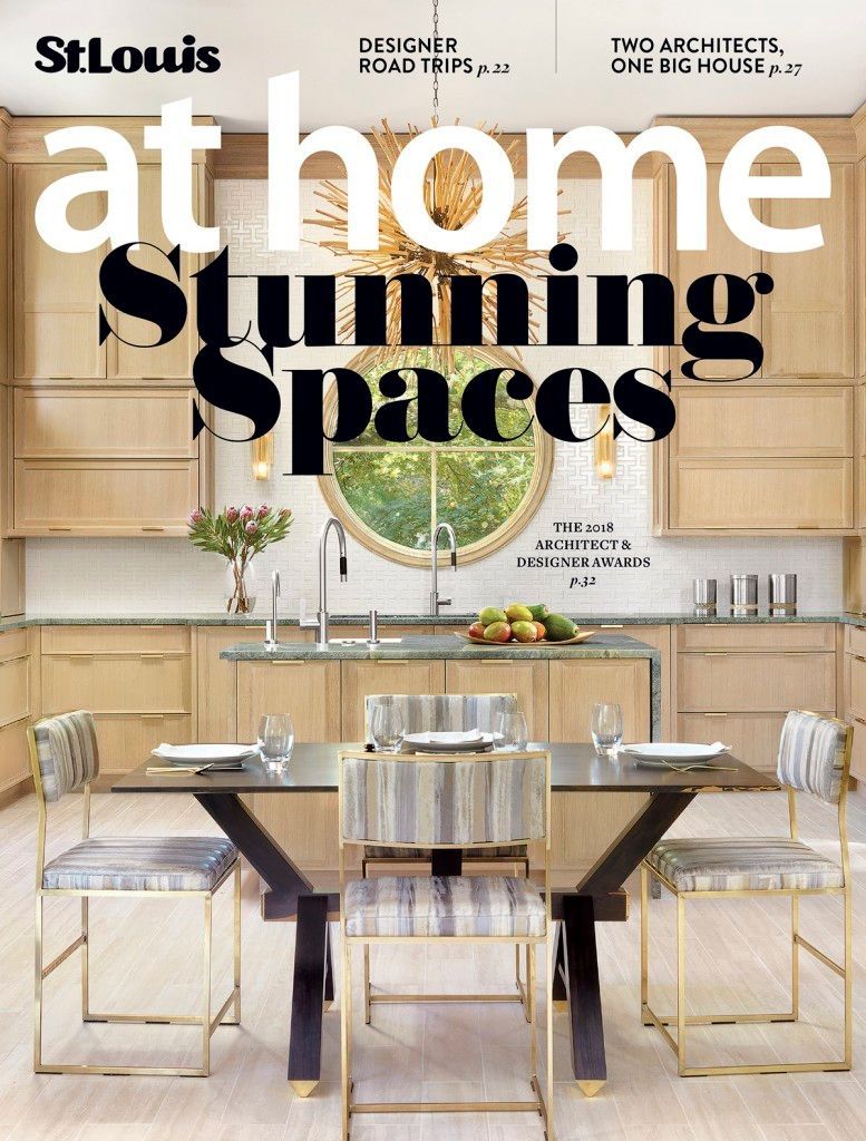 Cover of St. Louis at Home magazine featuring a modern kitchen with light wood cabinets, a dining table, and bar stools.