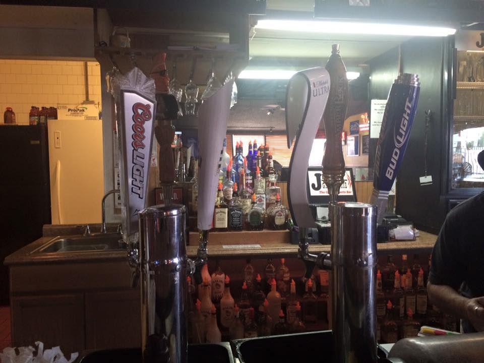 A bar with beer taps including bud light and budweiser
