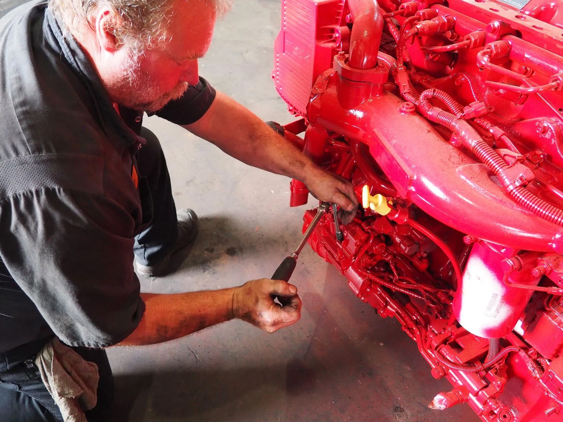 Technician working on engine repair