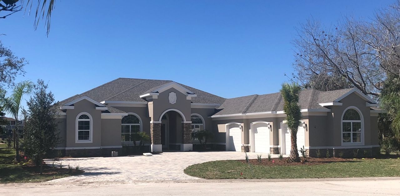 A large house with a driveway in front of it