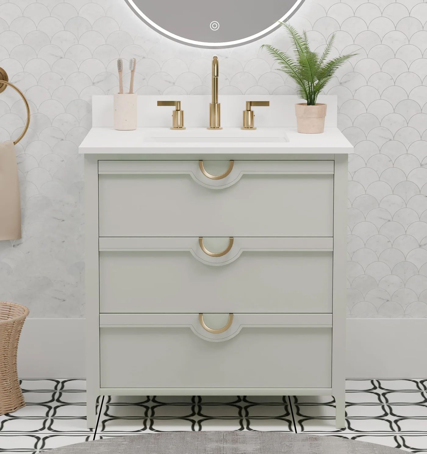 Modern white bathroom vanity with gold fixtures, round mirror, and potted plant on patterned tile floor