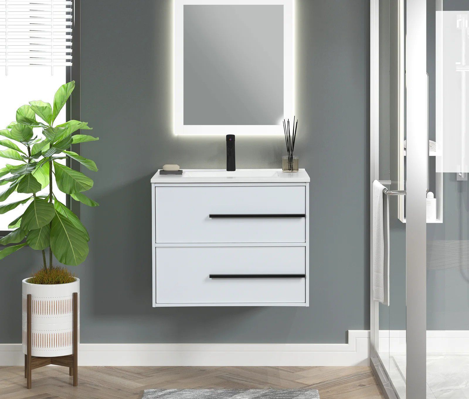 Modern bathroom vanity with white cabinet, mirror, plant, and glass shower door