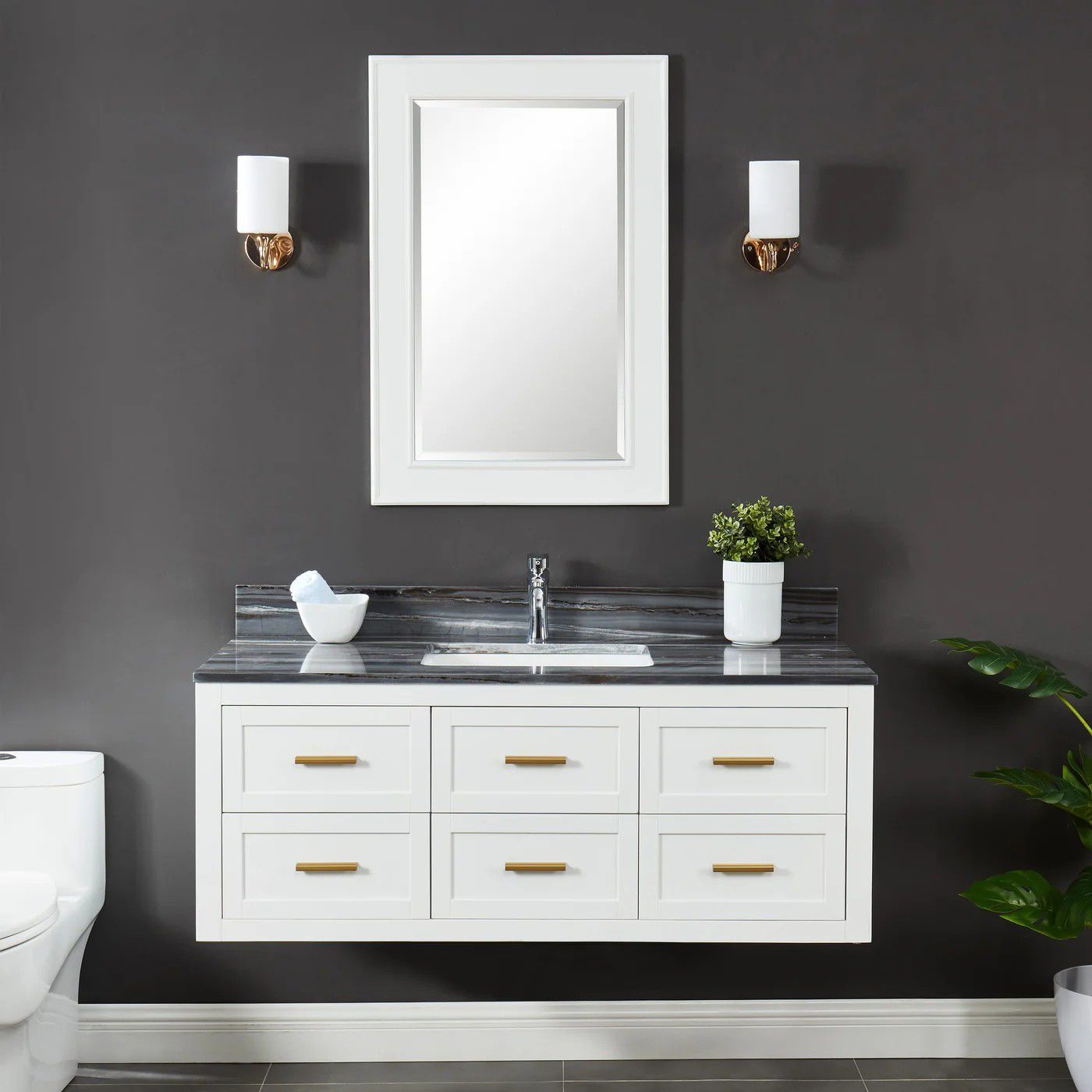 Modern white bathroom vanity with double sink, mirror, wall sconces, and dark gray walls