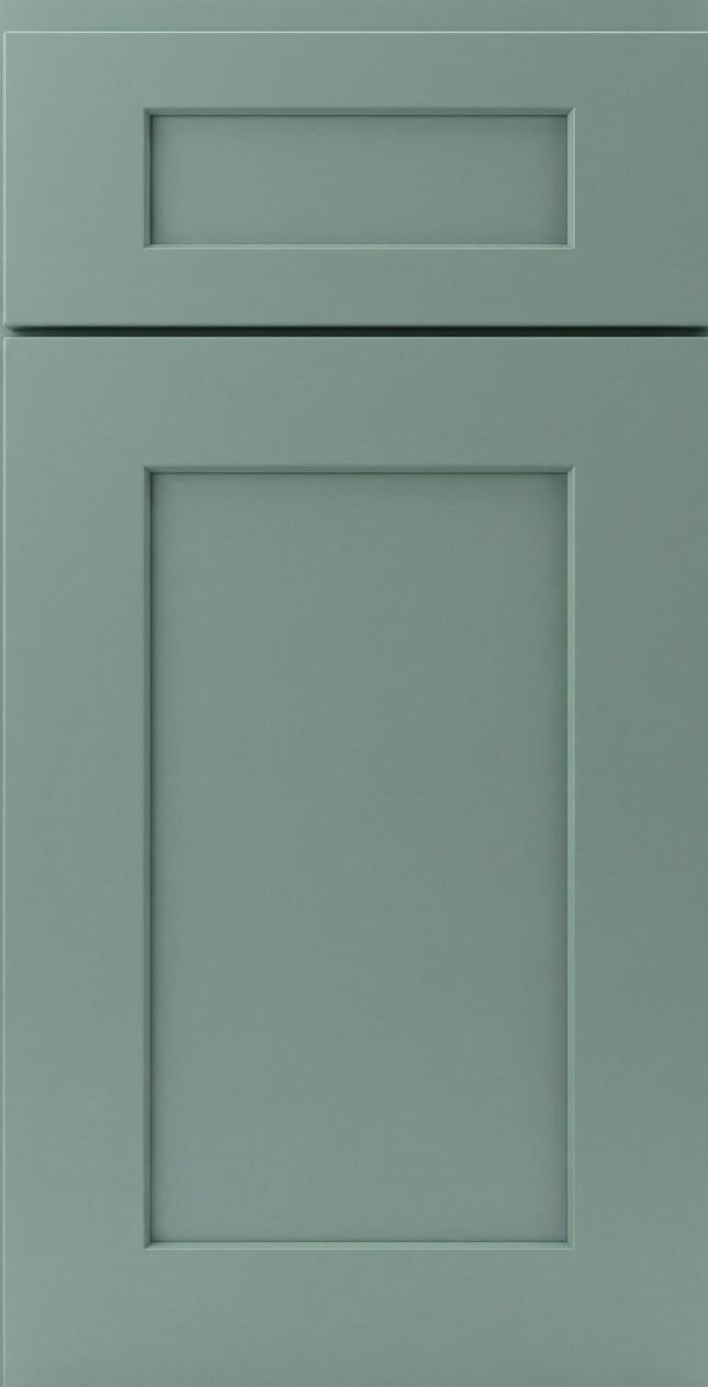 Muted green cabinet door with recessed rectangular panels