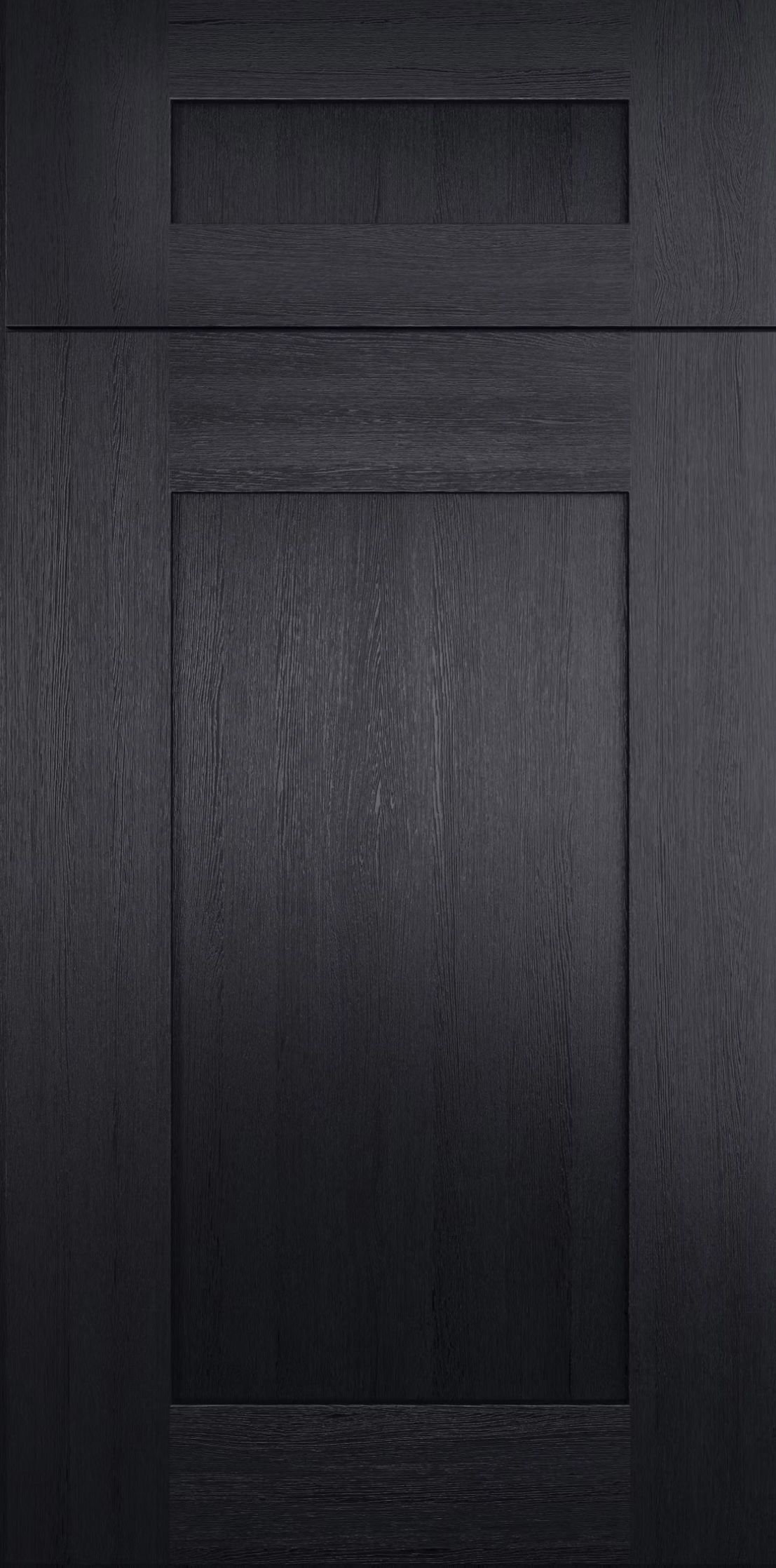 Dark wood cabinet door with a raised panel and small top drawer.