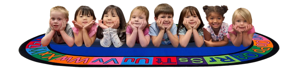 Seven smiling children leaning on colorful toy blocks in a row on a white background