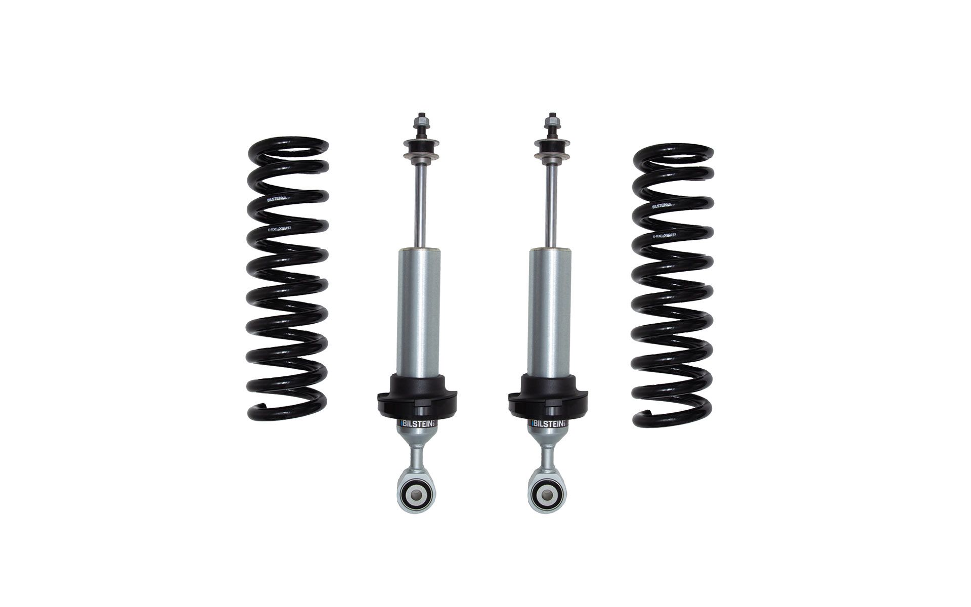 Two black coil springs and two silver shock absorbers against a white background.