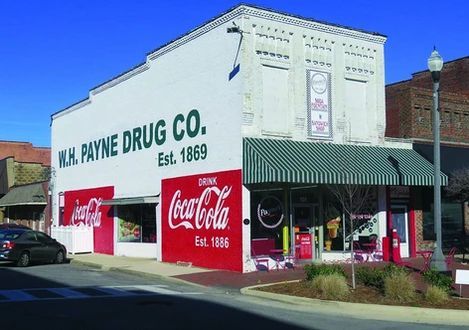 A coca cola store is located on the side of a building