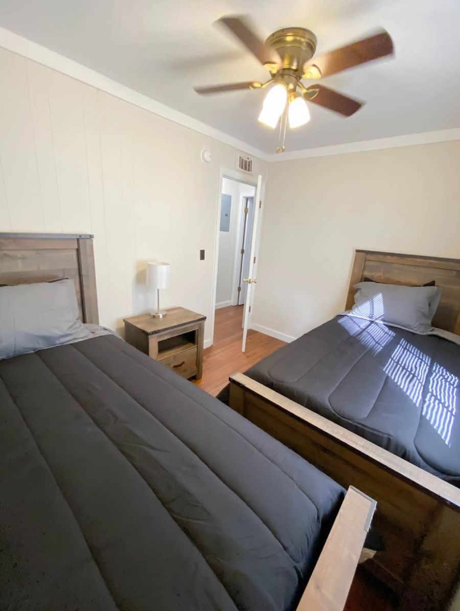 Two beds with ceiling fan