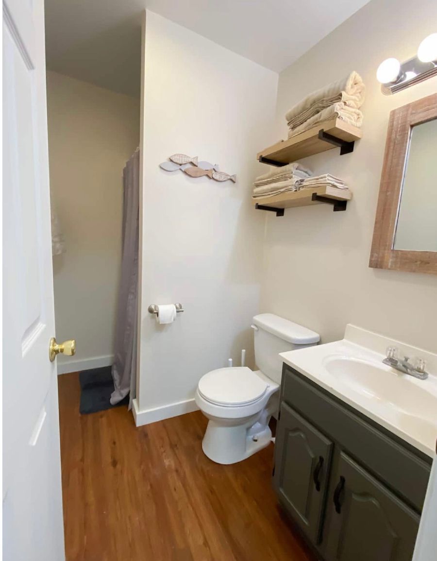A bathroom with a toilet and sink