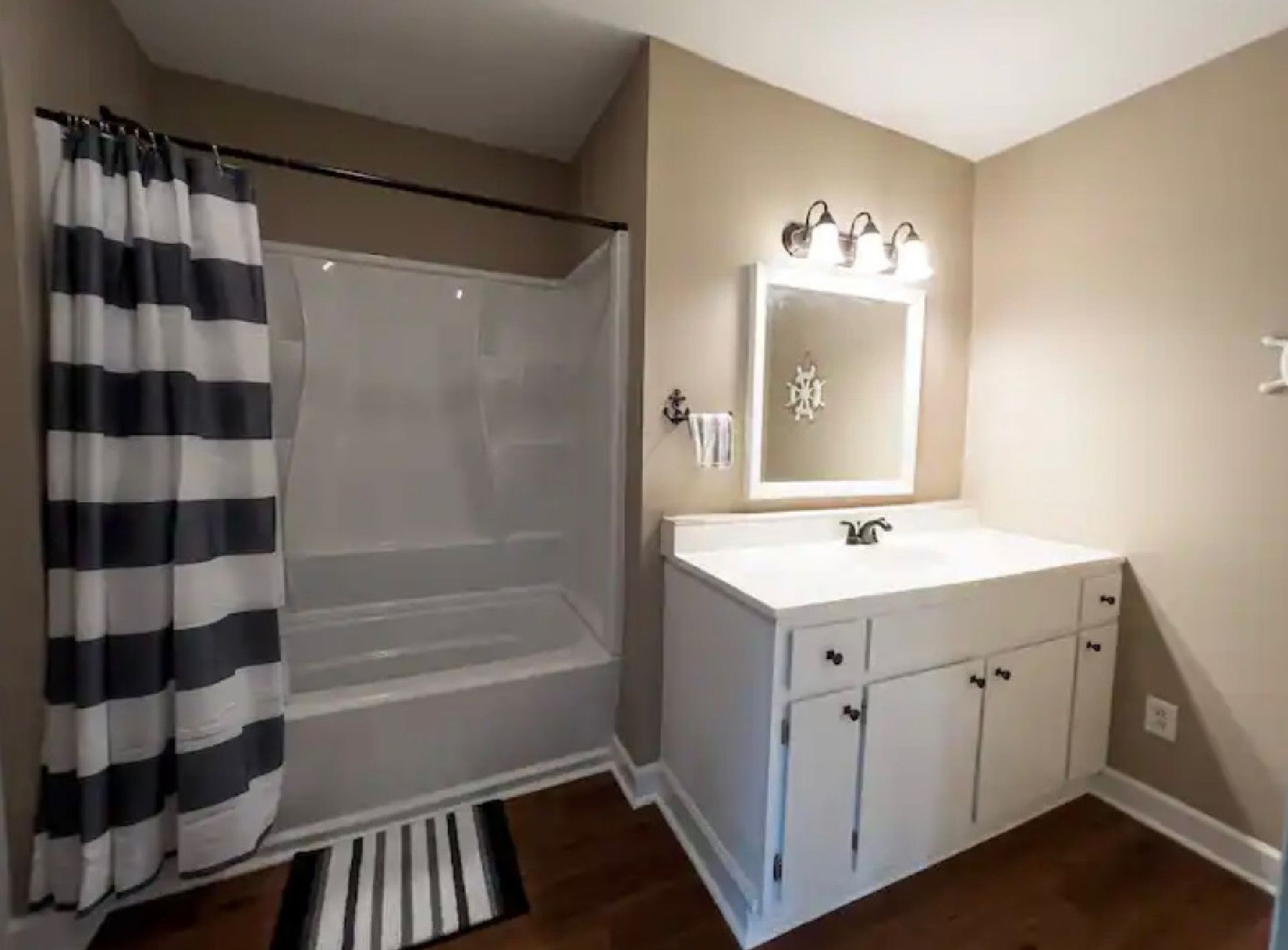 A bathroom with a sink and tub