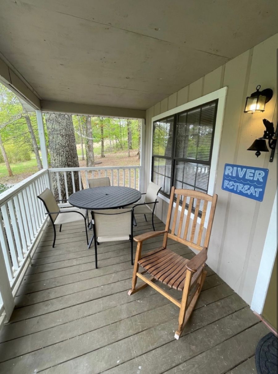 A porch with a rocking chair