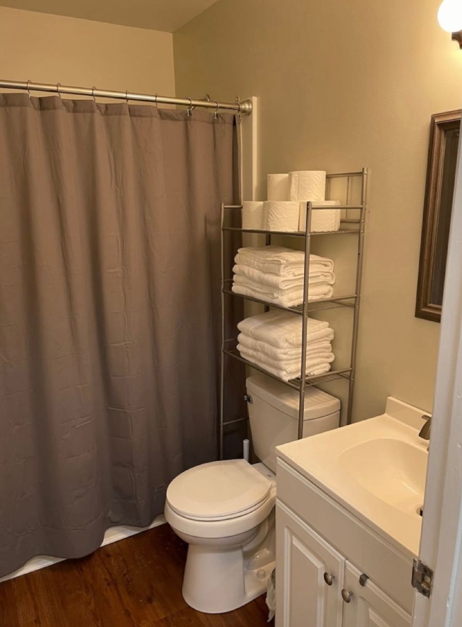 A bathroom with a toilet and sink