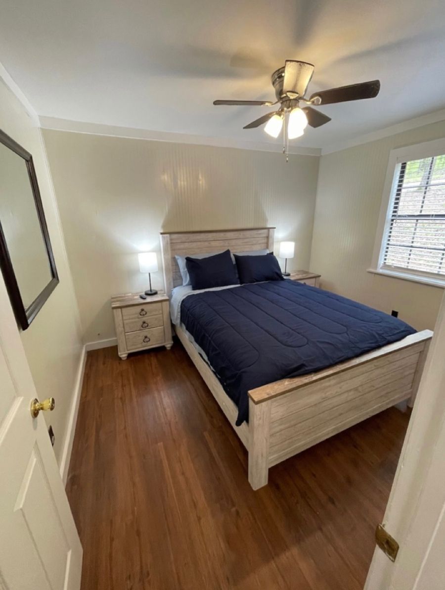 A bedroom with a bed