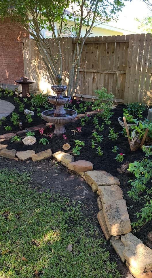 There is a fountain in the middle of the garden