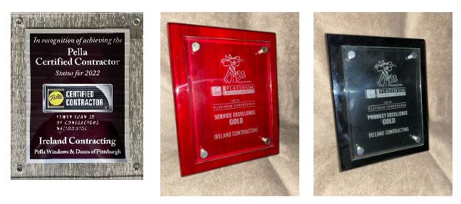 Three plaques are sitting next to each other on a table.