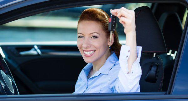 Woman holding a car key