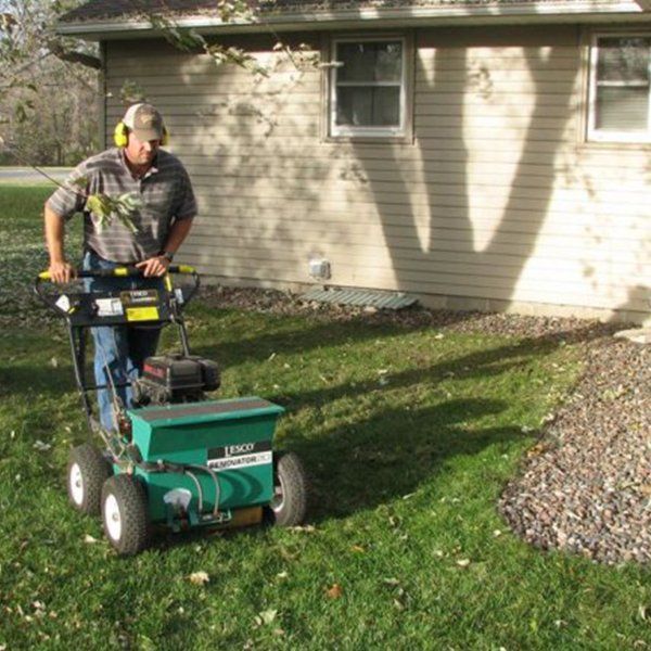 man with lawnmower