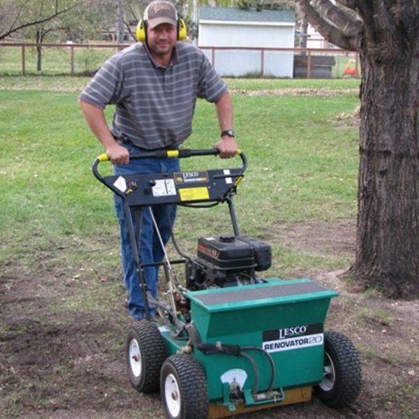 Man with lawnmower