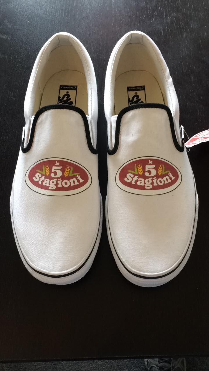 Pair of white Vans slip-on shoes with 