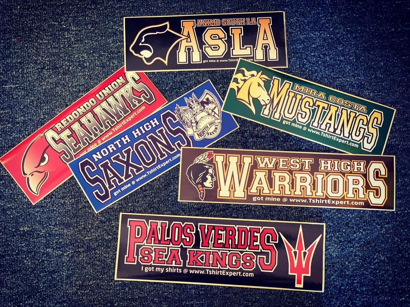 Seven school bumper stickers: ASLA, Redondo Seahawks, North High Saxons, Mira Costa Mustangs, West High Warriors, and Palos Verdes Sea Kings.