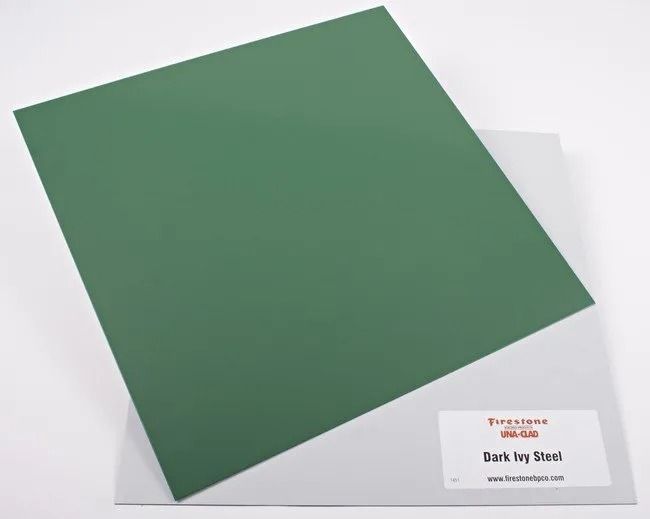 Dark green square paper sample on a white background with a small label card.