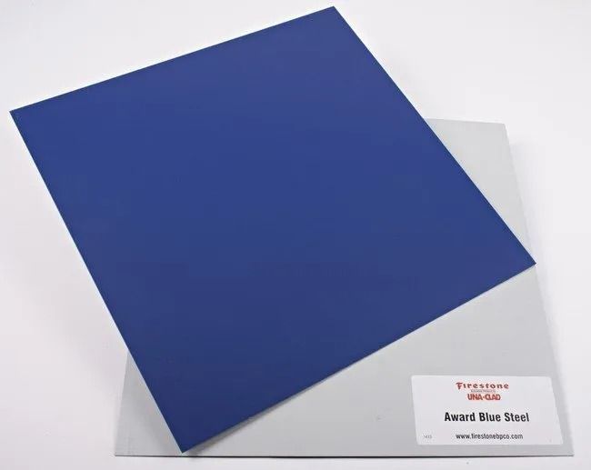 Blue square award plaque on a white background with a small label in the corner
