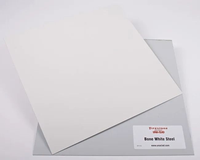Blank white canvas board on a gray surface with a small product label in the corner