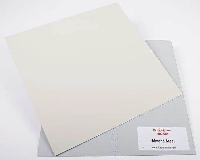 Large cream sheet of paper overlapping a smaller gray sheet with a label in the lower right corner