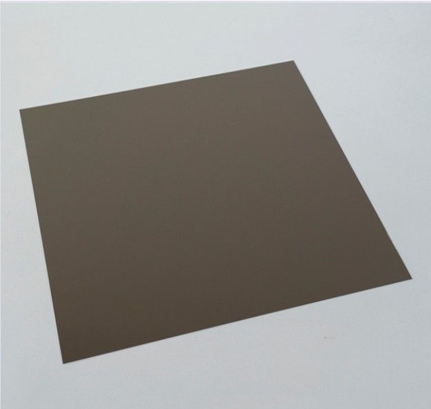 Dark brown square sheet of paper on a light gray background
