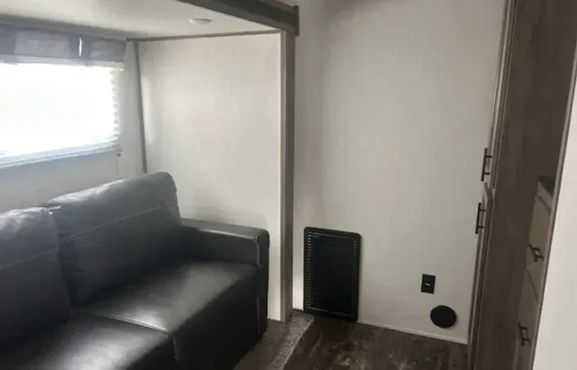 There is a couch in the middle of the room.