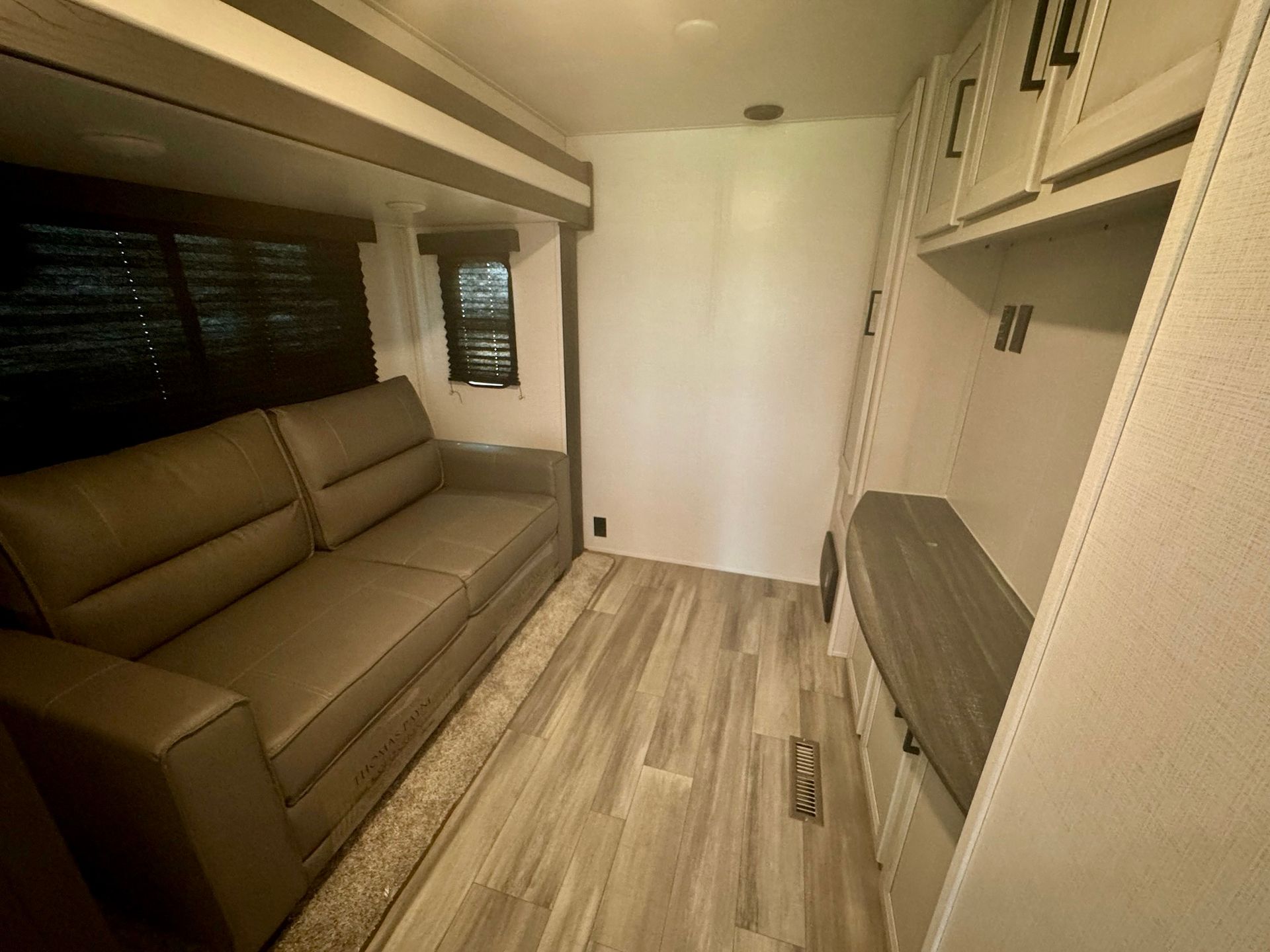 There is a couch in the middle of the room.