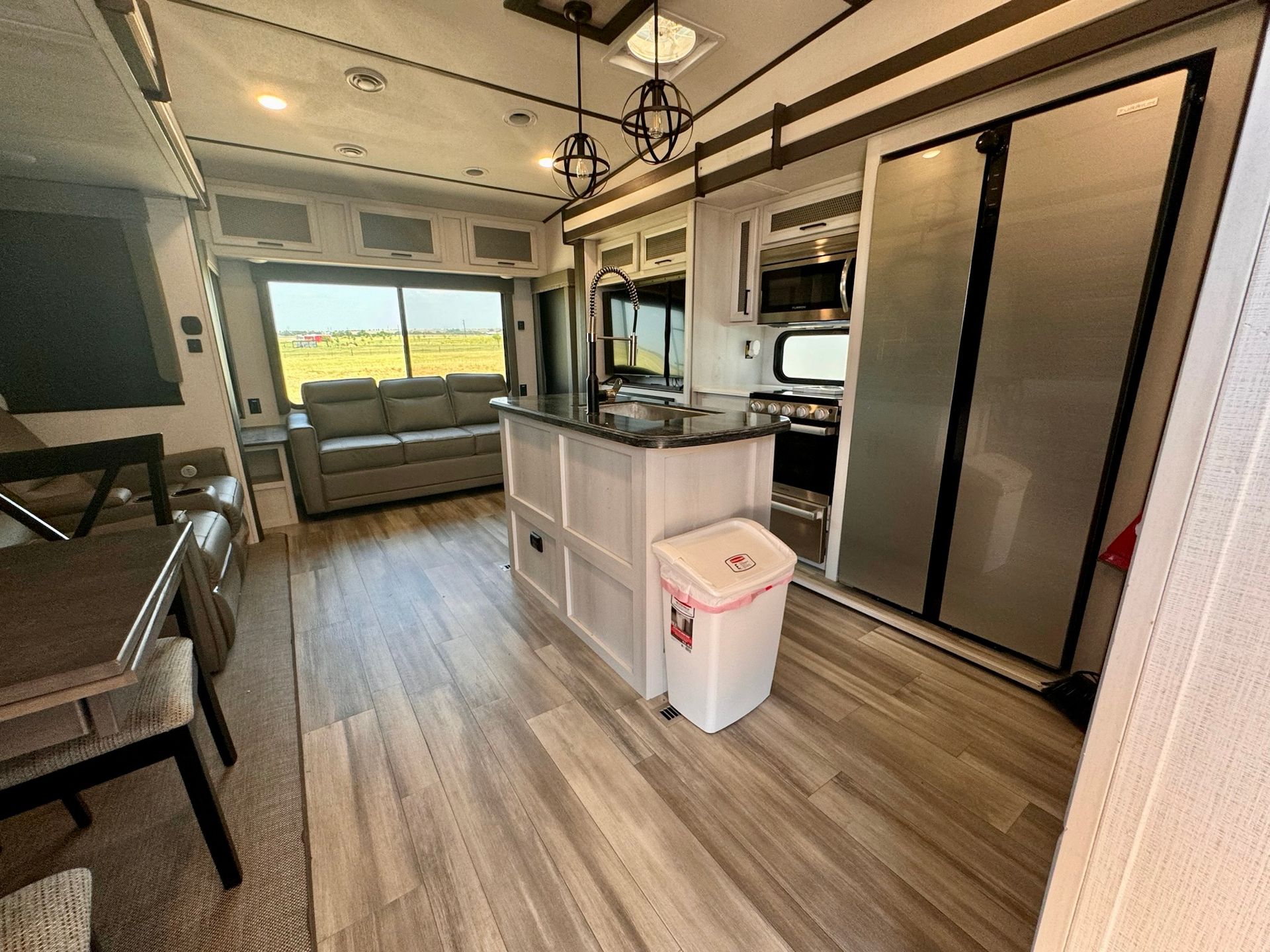 There is a trash can in the middle of the room.