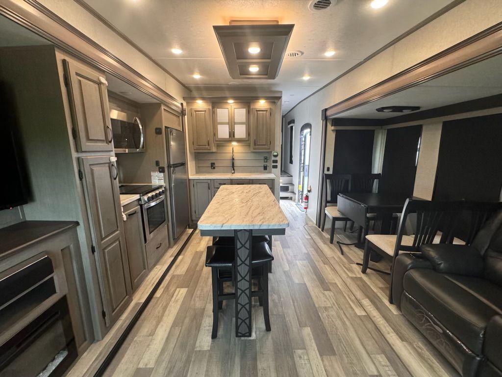 There is a large island in the middle of the room.