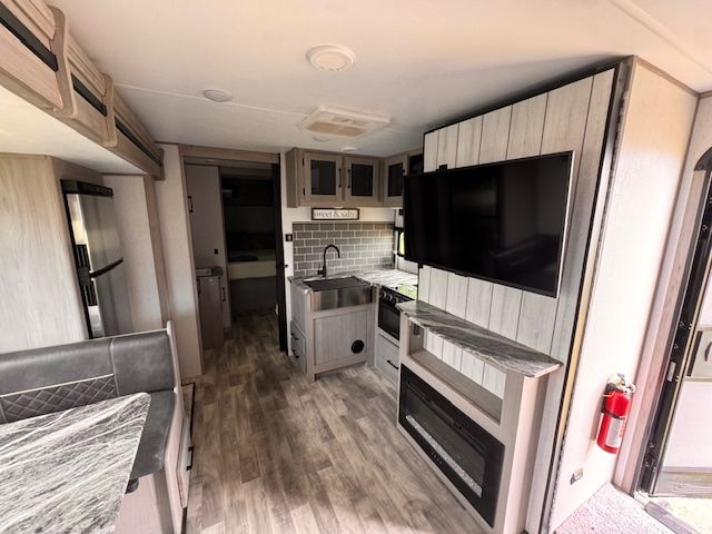 A rv with a flat screen tv mounted on the wall