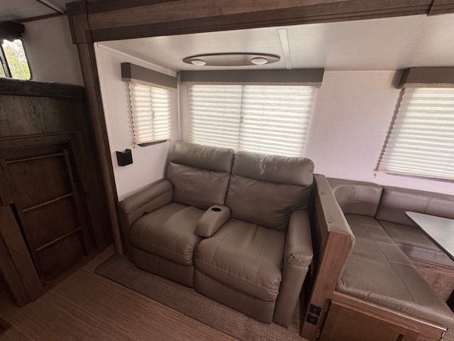 A living room with a couch and a window