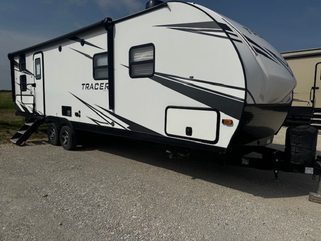 A white trailer with the word tracer on it