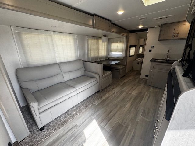 A living room with a couch and a table