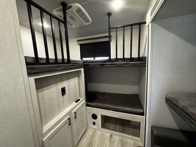 There is a bunk bed in the middle of the room.