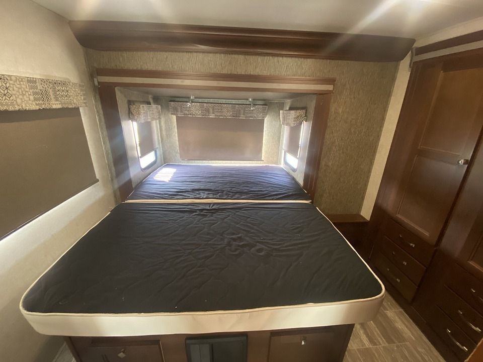 There is a bed in the middle of the room.